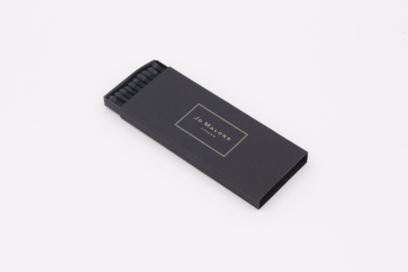 Luxury black matchbox with foil-stamped logo